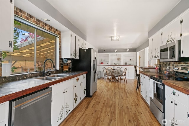 177 Salmon Creek Rd, Okanogan, WA 98840 - kitchen featuring a sink, white cabinets, and stainless steel appliances
