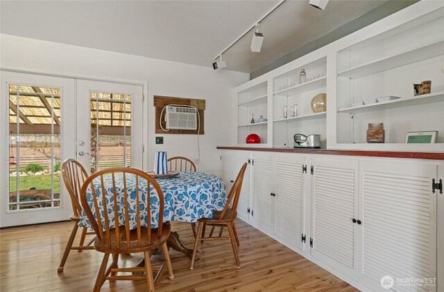 177 Salmon Creek Rd, Okanogan, WA 98840 - dining area featuring french doors, rail lighting, light wood-style floors, and a wall mounted AC