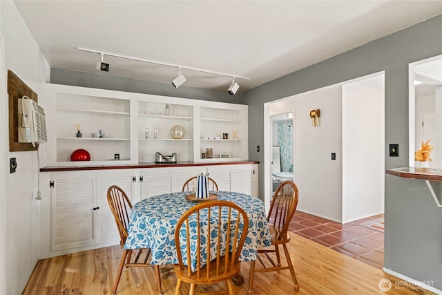 177 Salmon Creek Rd, Okanogan, WA 98840 - dining area with a wall mounted AC, track lighting, and light wood-style floors