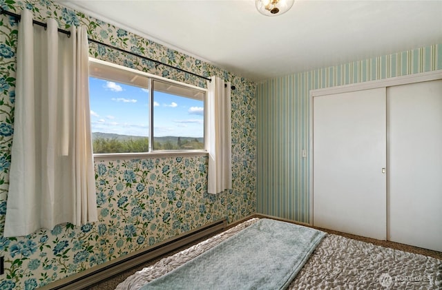 177 Salmon Creek Rd, Okanogan, WA 98840 - unfurnished bedroom with a closet and wallpapered walls