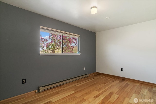 177 Salmon Creek Rd, Okanogan, WA 98840 - empty room with baseboards, baseboard heating, and light wood-style floors