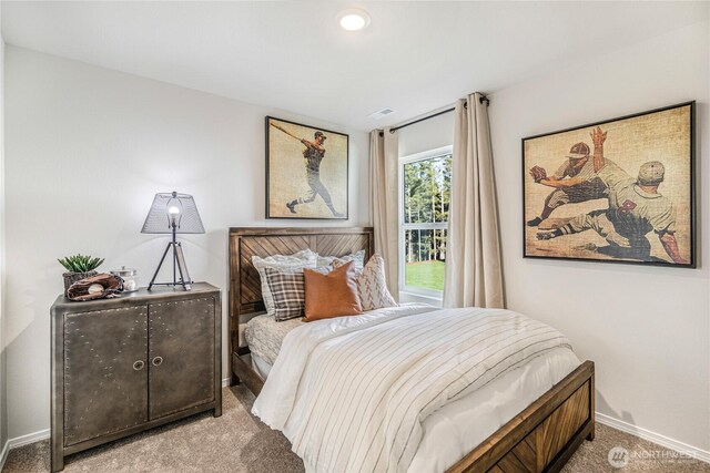 bedroom featuring carpet flooring and baseboards