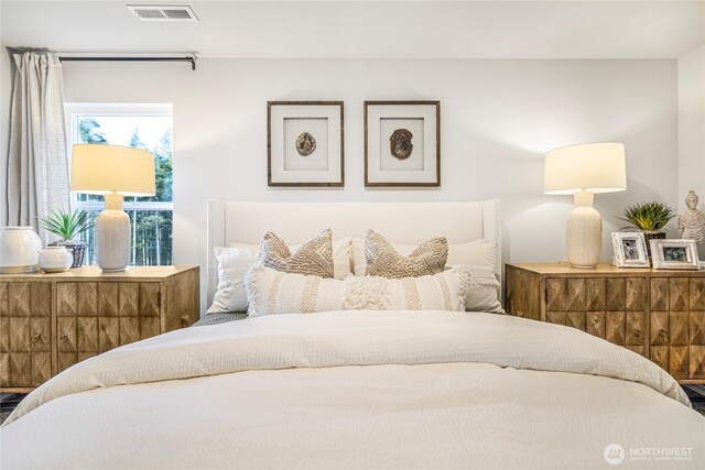 bedroom featuring visible vents