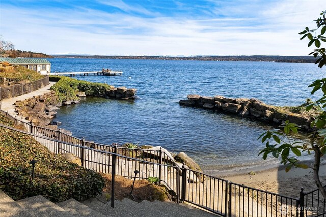 view of water feature featuring fence