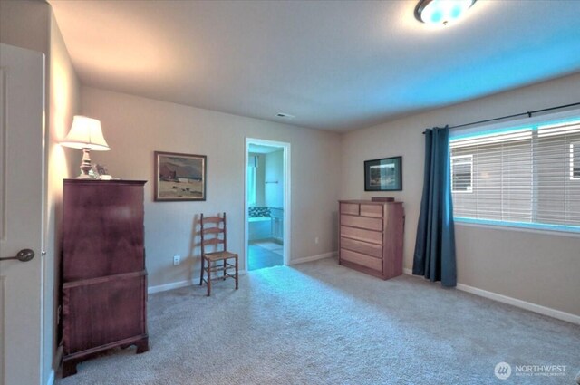 sitting room with carpet flooring and baseboards