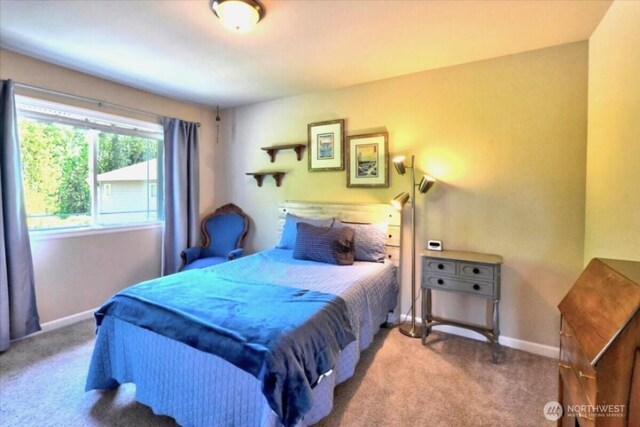carpeted bedroom with baseboards