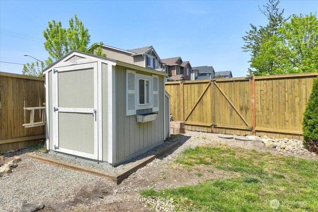 view of shed featuring a fenced backyard