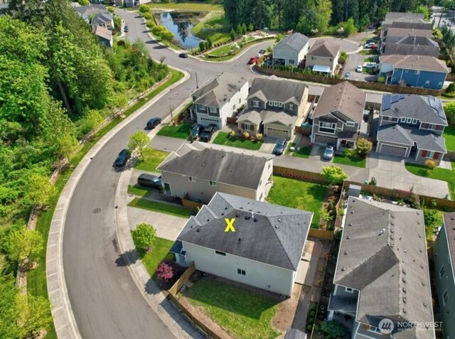 birds eye view of property with a residential view