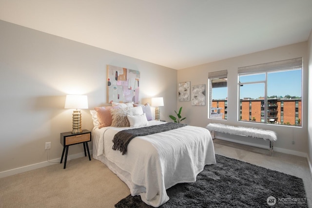 carpeted bedroom featuring baseboards