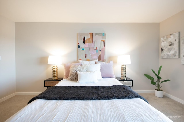 carpeted bedroom featuring baseboards