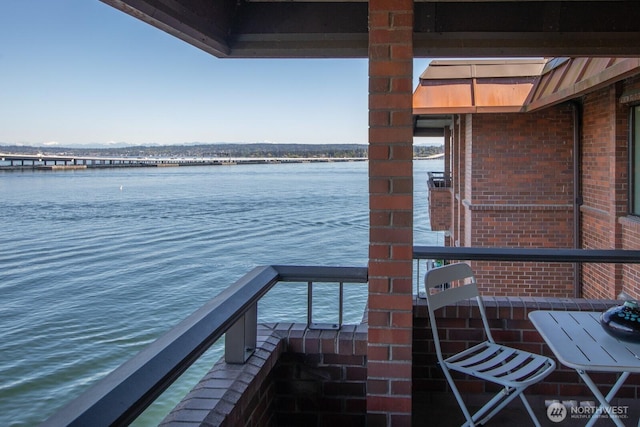 balcony featuring a water view