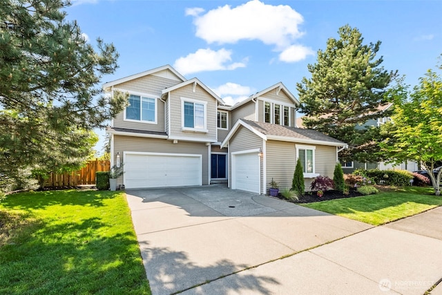 view of front of property with fence, an attached garage, concrete driveway, and a front yard