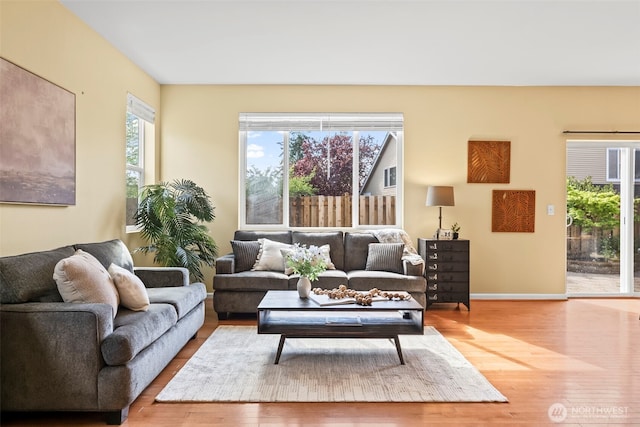 living room featuring baseboards and wood finished floors
