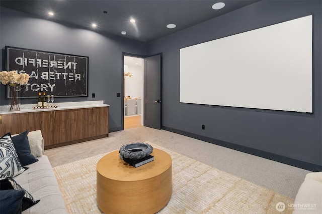 cinema room with recessed lighting and light carpet