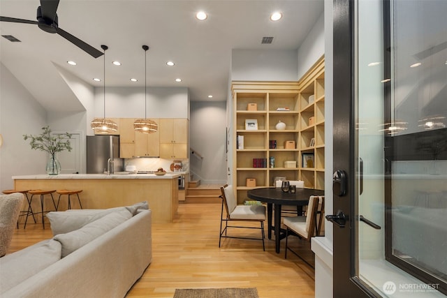 interior space featuring recessed lighting, ceiling fan, visible vents, and light wood-style floors