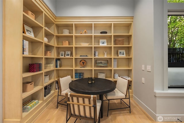 dining area featuring baseboards and wood finished floors