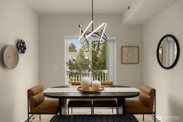 dining space featuring visible vents and baseboards