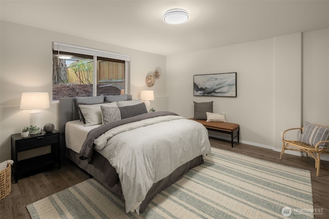 bedroom featuring baseboards and wood finished floors
