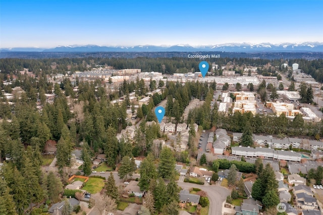 aerial view with a forest view, a residential view, and a mountain view