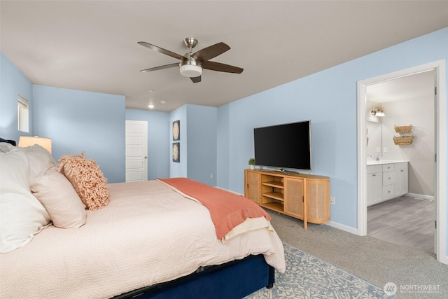 12011 SE 299th Pl, Auburn, WA 98092 - bedroom featuring connected bathroom, baseboards, ceiling fan, and carpet