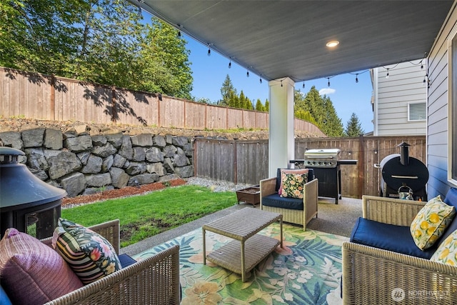12011 SE 299th Pl, Auburn, WA 98092 - view of patio featuring a fenced backyard, area for grilling, and outdoor lounge area