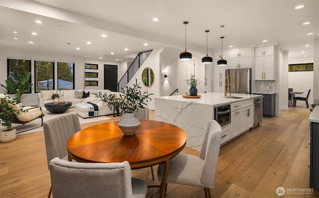 3230 290th Way NE, Redmond, WA 98053 - dining area featuring recessed lighting, light wood-style floors, and baseboards