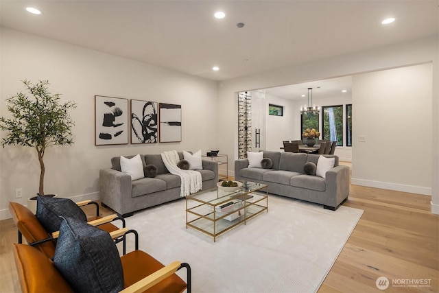 3230 290th Way NE, Redmond, WA 98053 - living room with light wood-type flooring, recessed lighting, baseboards, and a chandelier
