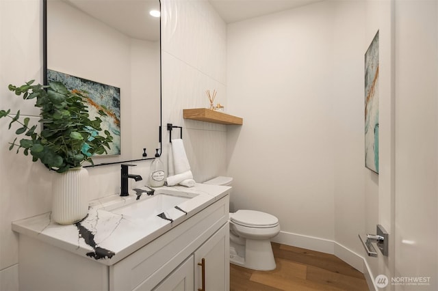 3230 290th Way NE, Redmond, WA 98053 - half bath featuring wood finished floors, toilet, vanity, and baseboards