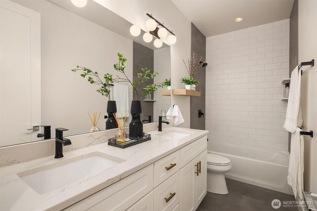 3230 290th Way NE, Redmond, WA 98053 - full bathroom featuring double vanity, tile patterned floors, toilet, recessed lighting, and shower / washtub combination