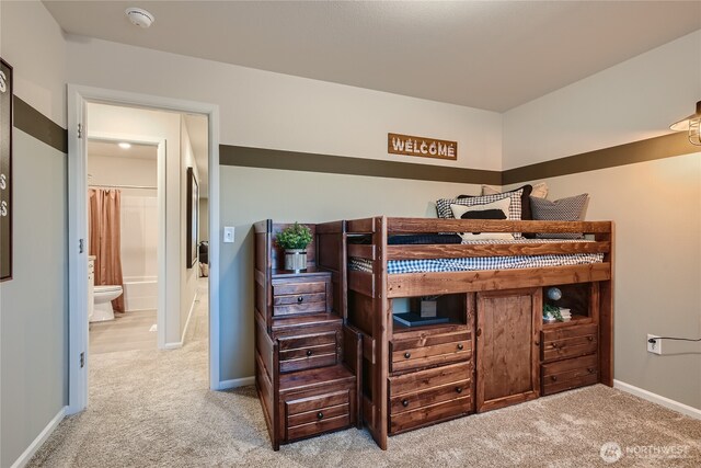 bedroom featuring carpet floors and baseboards