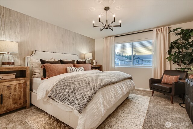 bedroom featuring baseboards, a chandelier, and light colored carpet