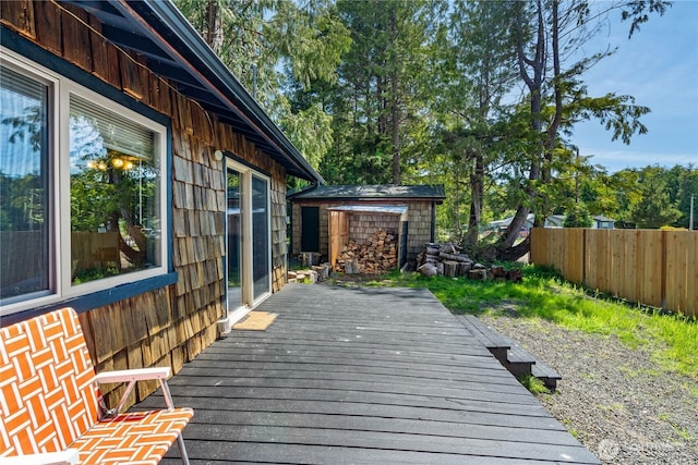 37 Butterfly Ln, Pacific Beach, WA 98571 - wooden terrace with an outbuilding, fence, and a storage shed