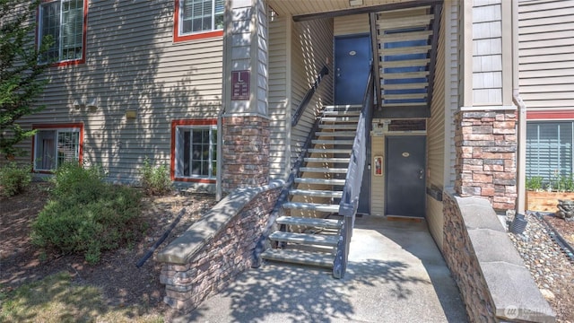 25025 SE Klahanie Blvd Unit L104, Sammamish, WA 98029 - property entrance with stone siding