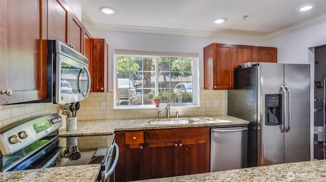 25025 SE Klahanie Blvd Unit L104, Sammamish, WA 98029 - kitchen with light stone countertops, appliances with stainless steel finishes, ornamental molding, and reddish brown cabinets