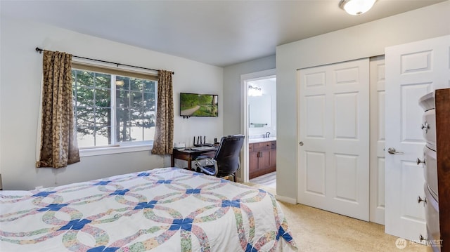 25025 SE Klahanie Blvd Unit L104, Sammamish, WA 98029 - bedroom featuring light carpet, a sink, and ensuite bath