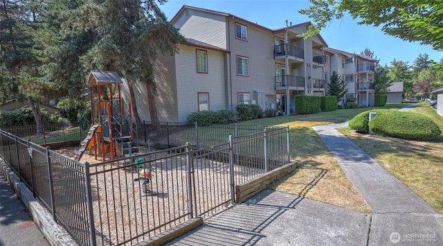 25025 SE Klahanie Blvd Unit L104, Sammamish, WA 98029 - view of home's community featuring fence, a lawn, and playground community