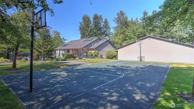25025 SE Klahanie Blvd Unit L104, Sammamish, WA 98029 - view of sport court featuring basketball hoop, fence, and a lawn