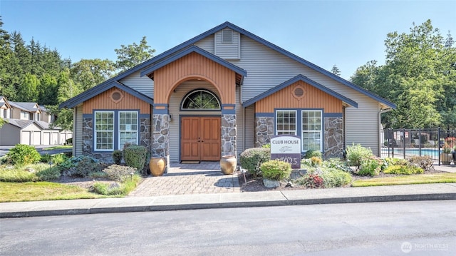 25025 SE Klahanie Blvd Unit L104, Sammamish, WA 98029 - view of front of property featuring fence and stone siding