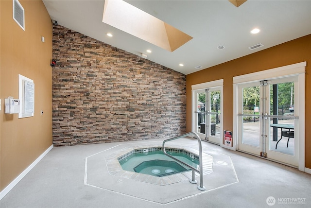 25025 SE Klahanie Blvd Unit L104, Sammamish, WA 98029 - view of pool featuring an indoor in ground hot tub, a skylight, and french doors