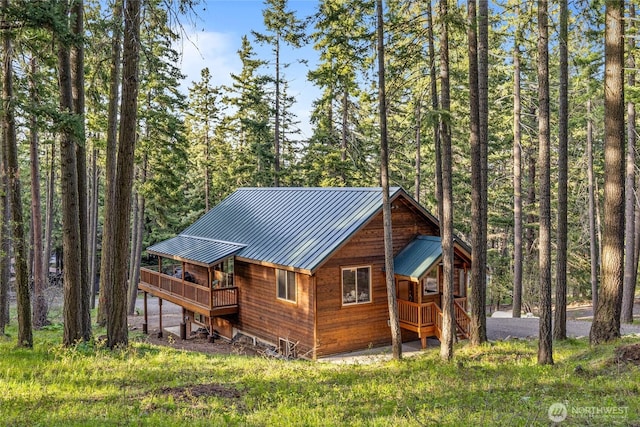 1570 Skull Springs Rd, Cle Elum, WA 98922 - back of property featuring a deck and a wooded view