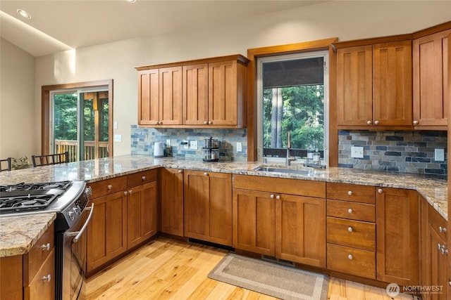 1570 Skull Springs Rd, Cle Elum, WA 98922 - kitchen with a sink, healthy amount of natural light, brown cabinets, and recessed lighting
