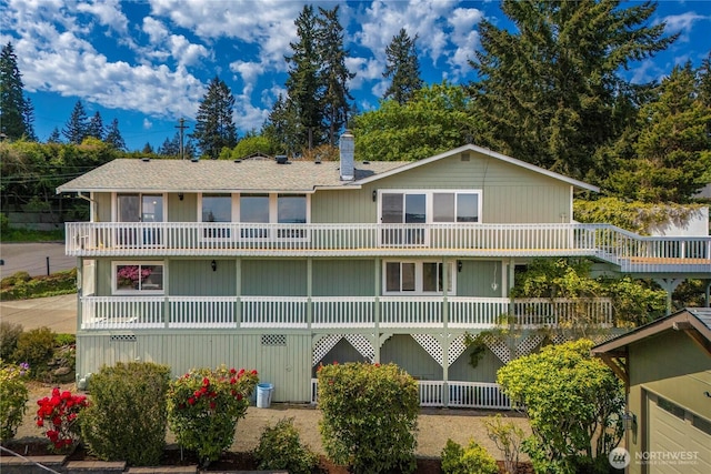 1319 Madrona Way NW, Gig Harbor, WA 98332 - back of house featuring a chimney and a balcony