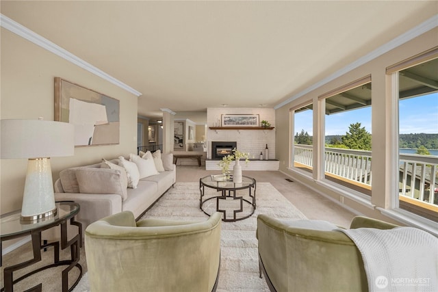 1319 Madrona Way NW, Gig Harbor, WA 98332 - living room with a large fireplace, ornamental molding, and light colored carpet