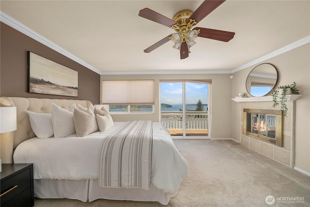 1319 Madrona Way NW, Gig Harbor, WA 98332 - carpeted bedroom with ornamental molding, a fireplace, ceiling fan, baseboards, and access to exterior