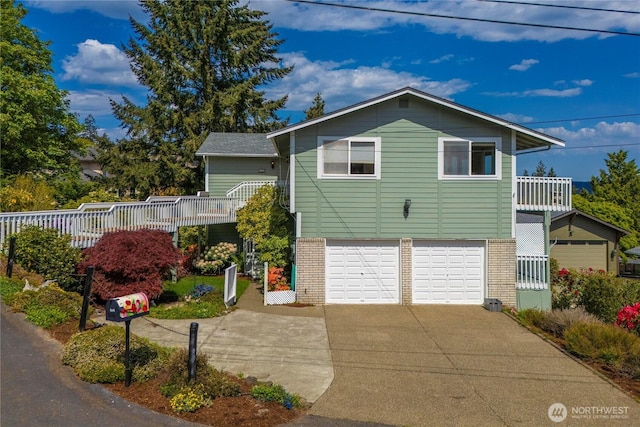 1319 Madrona Way NW, Gig Harbor, WA 98332 - view of front of property with driveway, brick siding, an attached garage, and fence