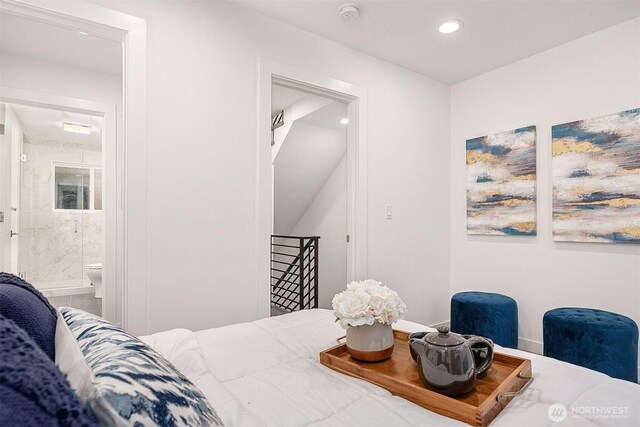 bedroom with recessed lighting and ensuite bath