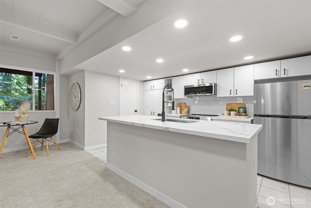 18265 47th Pl NE, Lake Forest Park, WA 98155 - kitchen with stainless steel appliances, recessed lighting, light stone counters, white cabinetry, and beamed ceiling