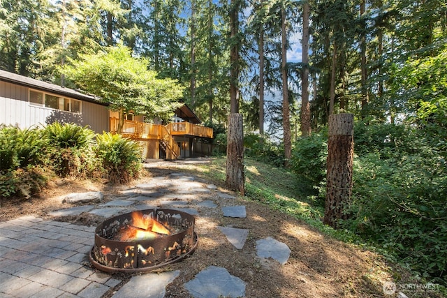 18265 47th Pl NE, Lake Forest Park, WA 98155 - view of yard featuring an outdoor fire pit, stairway, and a deck