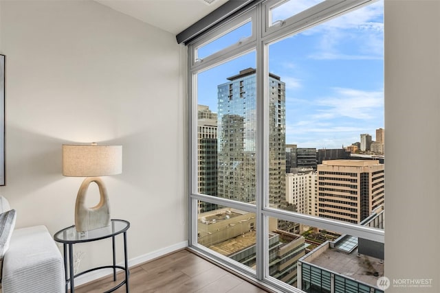 819 Virginia St Unit 3006, Seattle, WA 98101 - interior space with baseboards, a city view, and wood finished floors