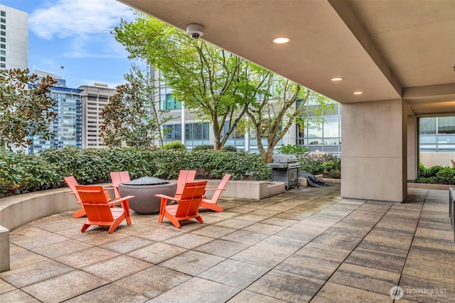 819 Virginia St Unit 3006, Seattle, WA 98101 - view of patio / terrace featuring a fire pit and a grill